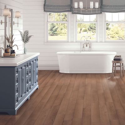 luxury vinyl plank flooring in a rustic bathroom